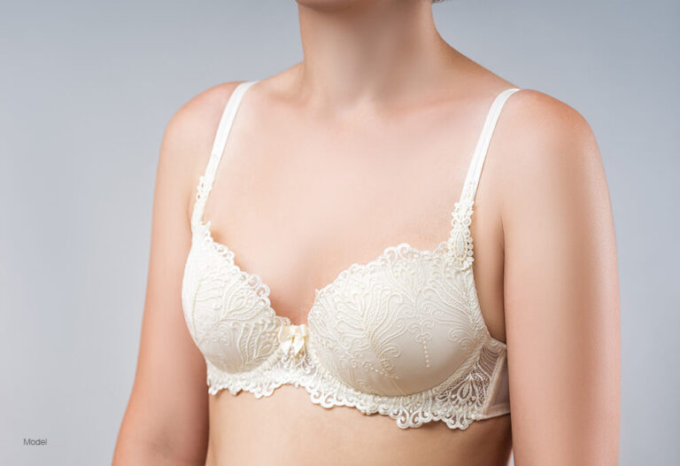 Woman with small breast in a white bra