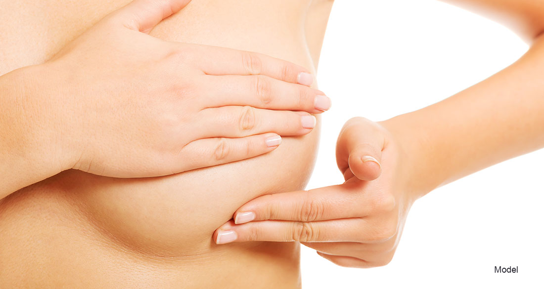 Woman touching her breasts
