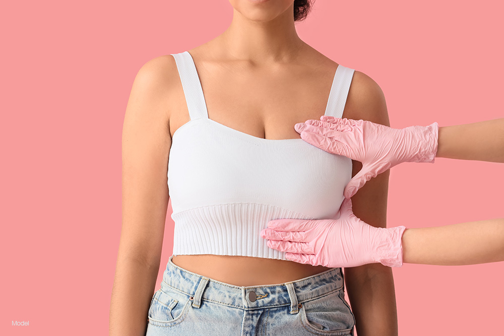 Doctor inspecting a womans breast